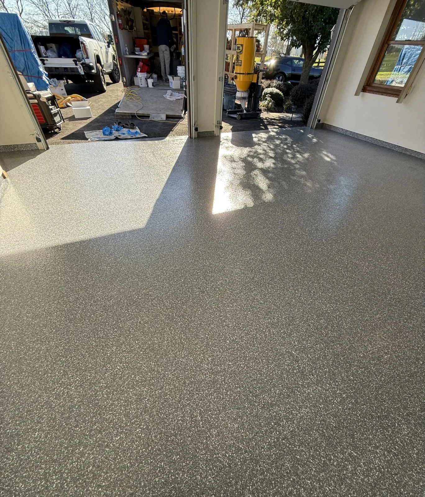 Custom Blizzard flake floor facing the open garage doors
