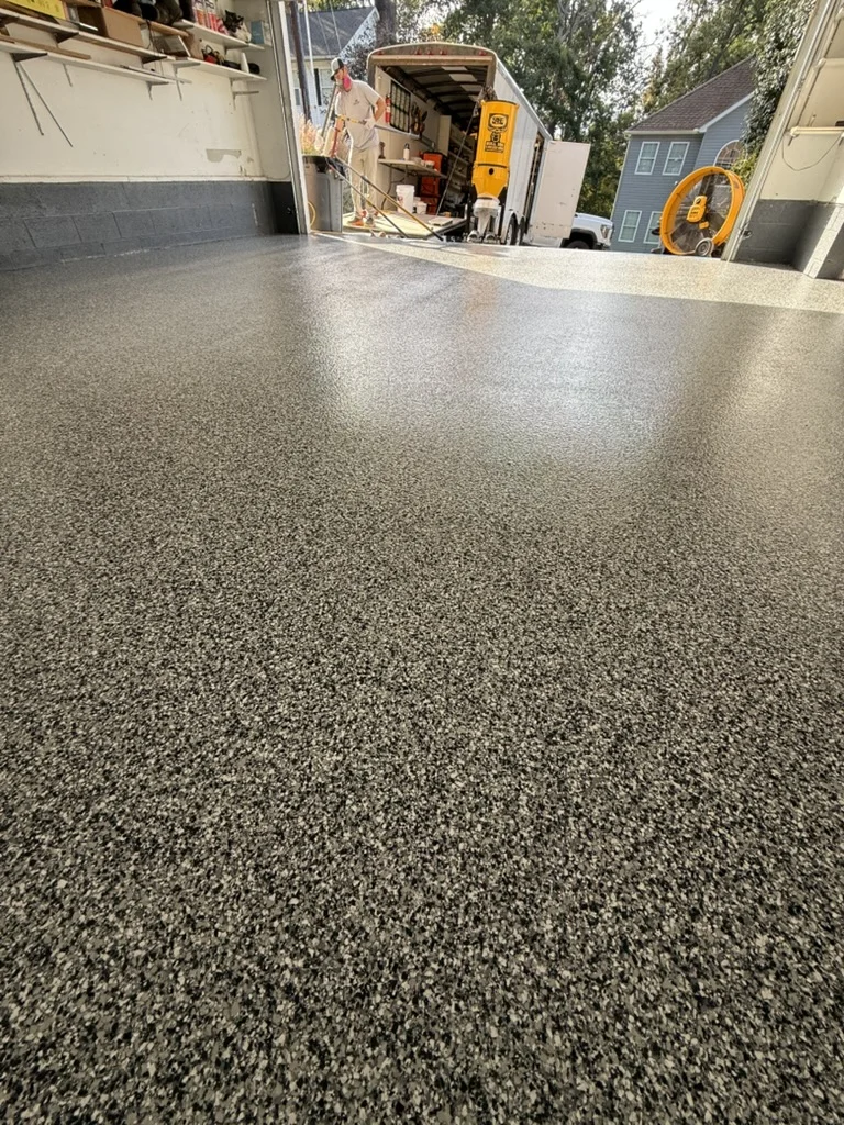 Low-angle view of the finished flake floor texture in the Charleston garage.