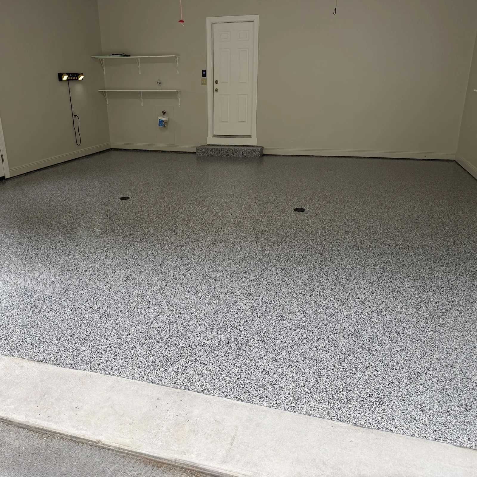 After — Gray flake garage and entry step, detail 2