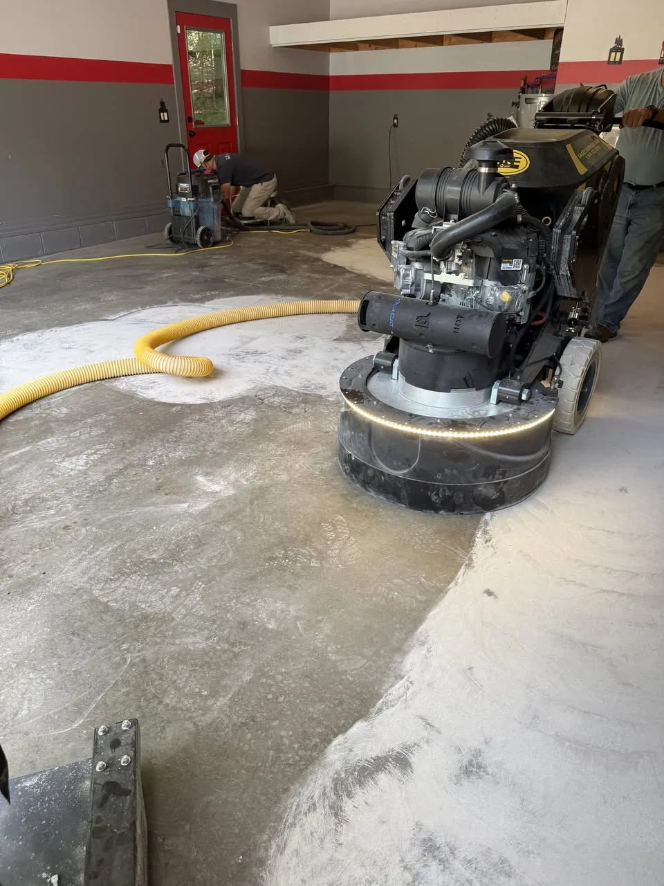 Before / preparation — floor preparation equipment on the original concrete