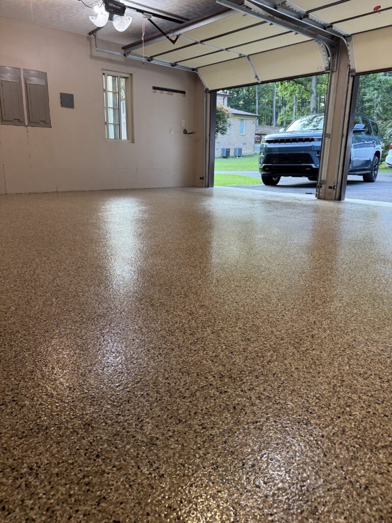 Warm-tone decorative flake garage floor in Beckley, West Virginia