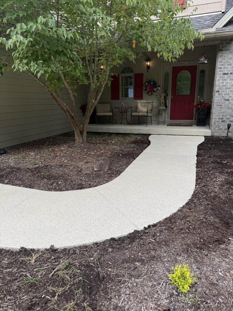 Finished curved front walkway leading to a home in Shady Spring, West Virginia
