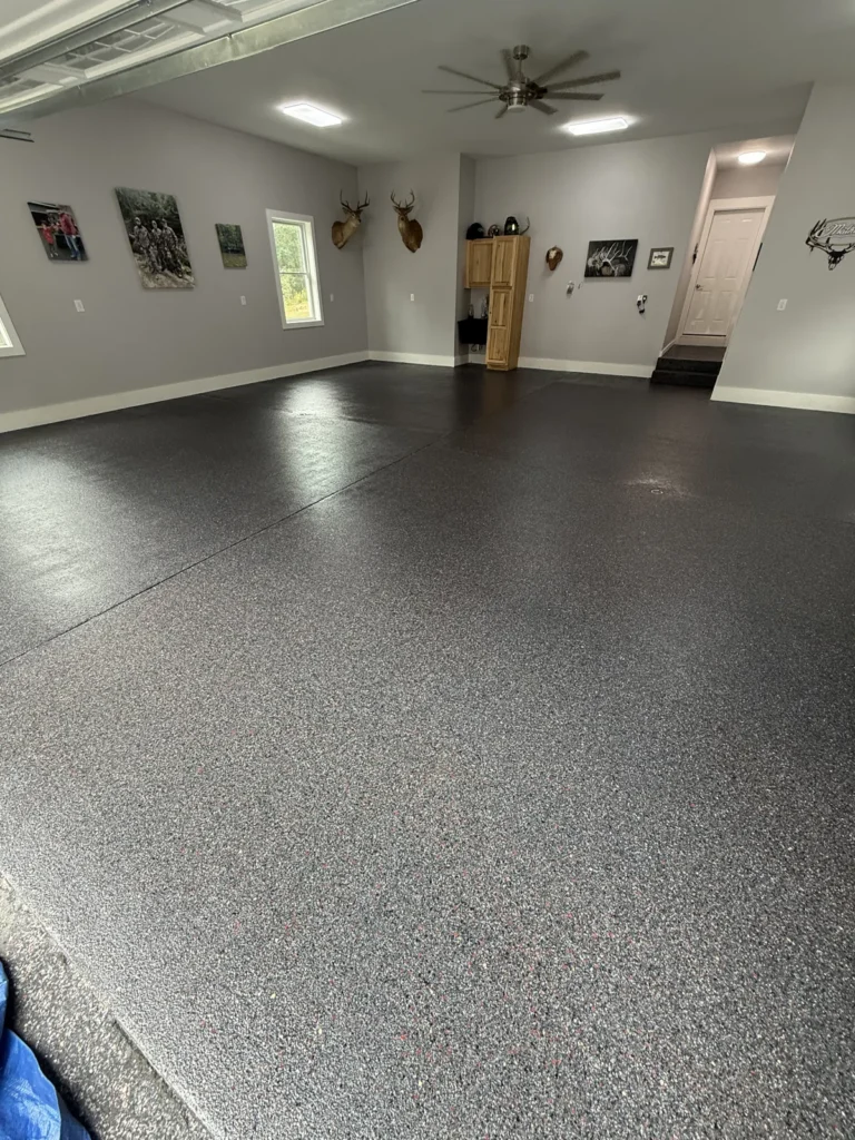 Dark decorative flake floor installed by Epoxy King in Greenbrier County, West Virginia