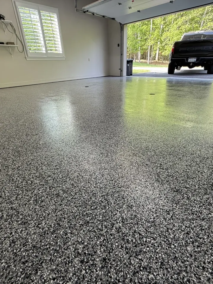 After — Gray flake garage and entry step